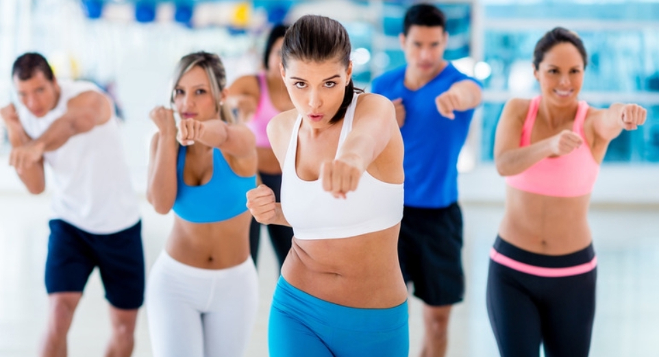 a group of people in a workout class