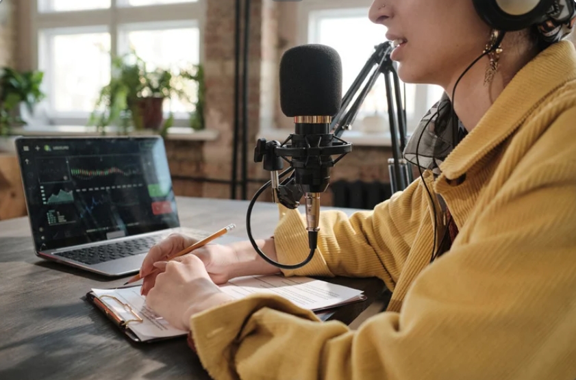 Image of someone recording a podcast